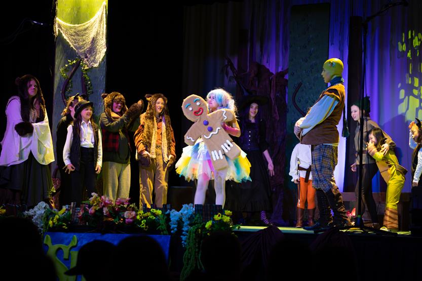 Students perform onstage